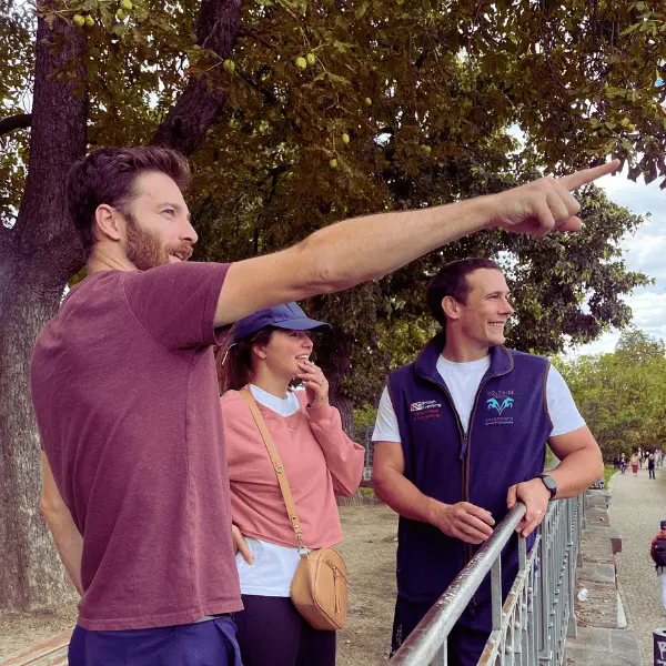 Licensed Prague private tour guide explaining history to couple